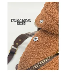 Macro detail of plush brown backpack featuring detachable hood and metal zipper