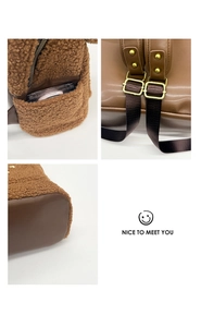 Detailed close-up of brown faux shearling backpack showing strap buckles and side pocket