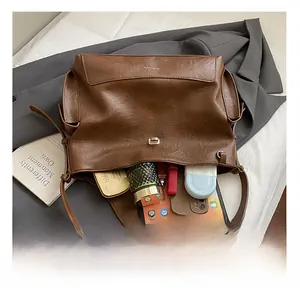 Interior view of brown leather tote bag showing large capacity for daily essentials