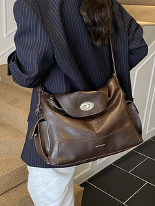 Brown vintage faux leather large tote bag with silver turn-lock and adjustable shoulder strap