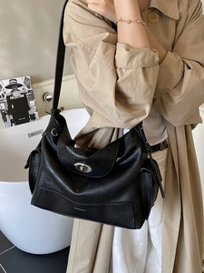Minimalist black leather tote bag with silver metal lock for casual commuting style