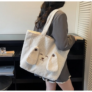 Close-up of fluffy white fleece tote bag featuring cute dog face embroidery and 3D ears