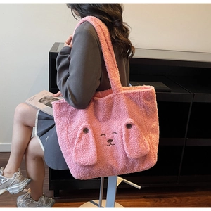 Detail of pink plush tote bag showing cute 3D dog ears and textured faux fur