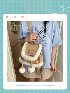 Detail of khaki bucket backpack with faux fur trim, pom-poms, and cute cat patterns