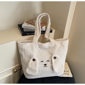 Close-up of cute plush animal tote bag with 3D ears and soft sherpa fleece texture