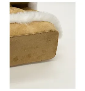Close-up of the reinforced bottom base and faux fur trim on the plush backpack