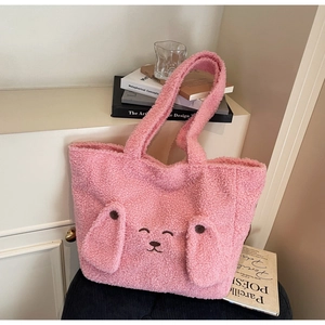 Detailed view of the pink teddy fleece tote bag with cute animal embroidery and buttons