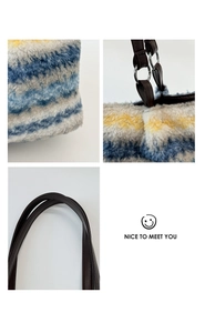 Detail of striped faux fur tote bag showing plush texture and brown leather handle