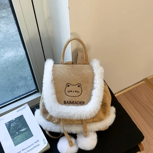 Detail of cute cat embroidery and white faux fur trim on a brown bucket backpack