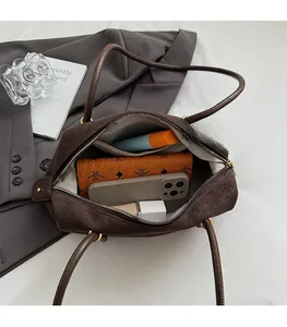 Top view of open dark brown suede tote bag showing large capacity interior and pockets