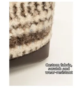 Detail of wool fabric and leather stitching showing scratch-resistant material durability