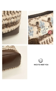 Detail of multi-color sherpa fleece fabric with a dog girl patch and retro wooden buttons