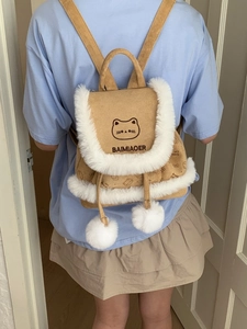 Brown suede bucket backpack with cat embroidery and white faux fur trim detail