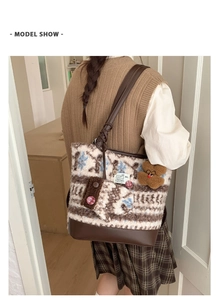Winter wool tote bag detail with knit snowflake pattern and brown leather straps