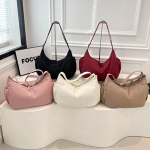 Minimalist large crescent tote bags in five colors with adjustable wide straps