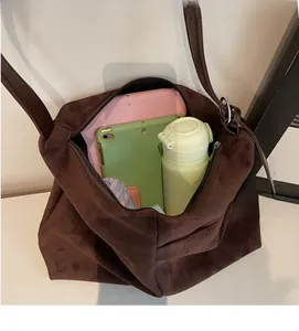 Deep brown suede tote bag showing large capacity for laptop, umbrella and water bottle