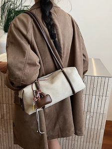 Retro large-capacity suede shoulder bag with brown leather strap and mini bag charm accessory