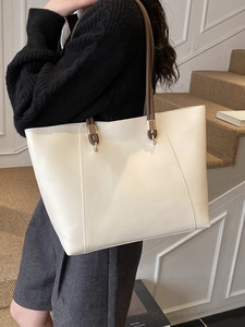 Minimalist large capacity white leather tote bag with brown handles and gold hardware