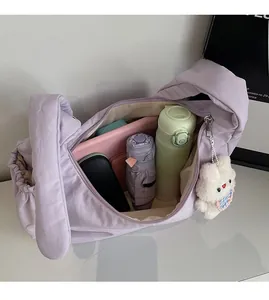 Interior view of lavender dumpling bag showing large capacity for tablet and umbrella