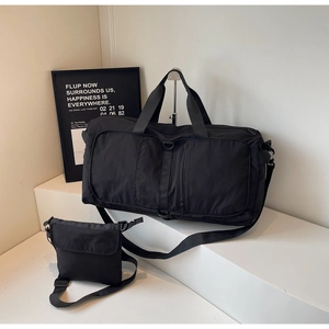 Waterproof nylon gym bag set including large duffel and matching small crossbody bag