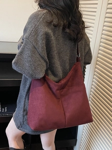 Vintage burgundy suede tote bag for women featuring a spacious shoulder carry design