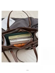 Brown textured tote bag interior showing capacity for a tablet, books, and phone
