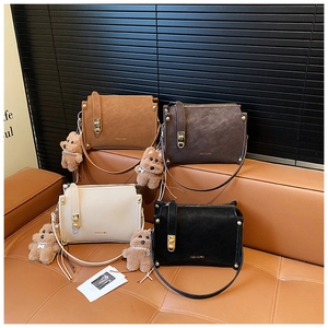 Elegant women's square handbags in caramel, coffee, white and black with plush charms