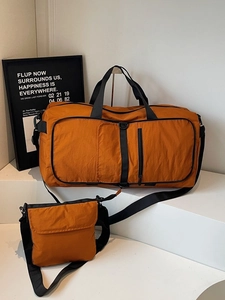Large orange travel duffel bag and crossbody set with durable nylon and black straps