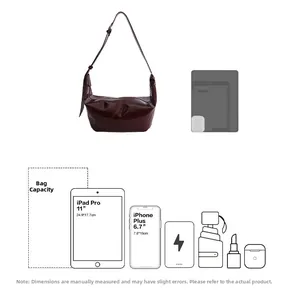 Detailed capacity guide showing a burgundy leather hobo bag holding an 11-inch iPad Pro
