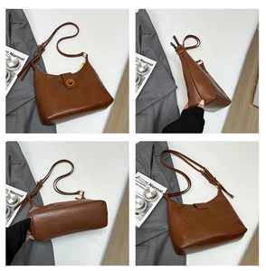 Detail view of brown leather bucket bag showing golden twist lock and saddle silhouette
