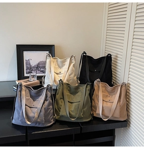 Corduroy tote bags in five colors with front flap pockets and magnetic metal buckles