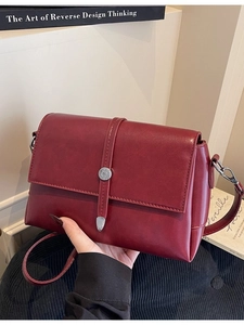 Vintage dark red crossbody square bag featuring a stylish silver buckle and leather strap