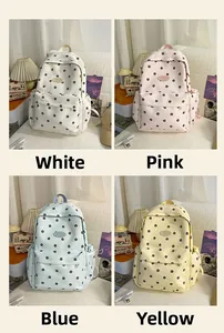 Detail view of four floral backpacks in white, pink, blue and yellow for students