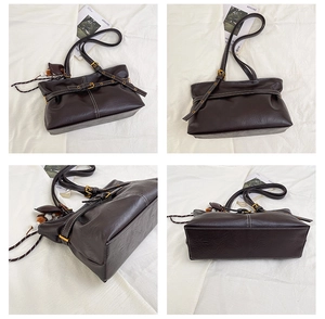 Detail view showing front, back, and side of the vintage dark brown tote bag with metal buckles