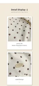 Detail of water-resistant beige floral canvas fabric with a sewn oval brand label