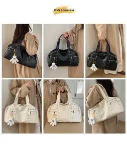 Style display of a large capacity faux leather tote bag with unique glove charm detail