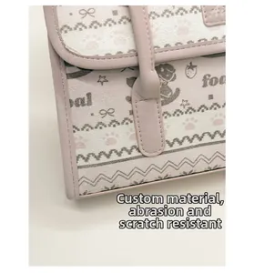 Close-up of scratch-resistant tote bag fabric with cute bow and cat paw patterns