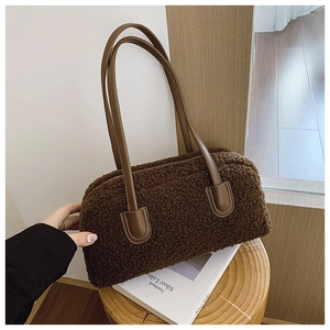 Detail of soft dark brown teddy fleece tote bag with smooth faux leather shoulder straps