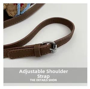 Detail view of adjustable brown lychee pattern leather strap with silver metal buckle