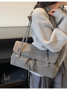 Retro grey matte tote bag with braided shoulder strap and bow detail on model