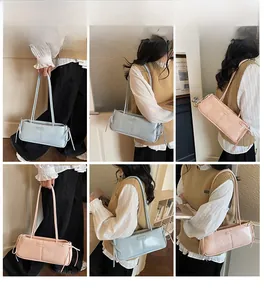 Detailed views of stylish bow baguette bags in pastel blue and pink with sleek strap knots