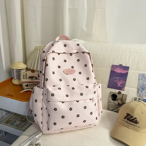 Detailed interior storage space of pink floral canvas backpack for students