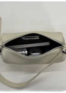 Interior detail of creamy white litchi pattern leather bag showing spacious capacity