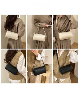 Detailed views of Boston cylinder bag with lychee texture in beige and black colors