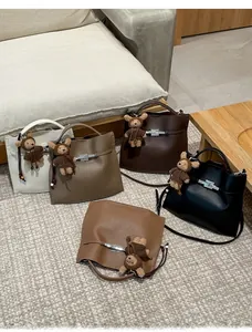 Litchi pattern leather handbags in five colors with cute bear charms and metal locks