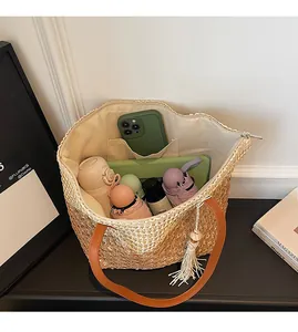 Interior view showing the spacious capacity of this woven straw tote bag with inner pocket