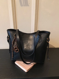 Black large capacity faux leather tote bag with unique knot charm and gold hardware