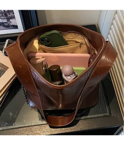 Top view showing the large capacity and multi-pocket interior of the brown tote bag