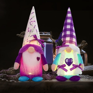 Glow-in-the-dark lavender plush gnomes with purple hats and heart detail decor