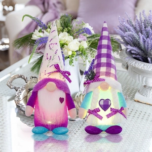 Pair of glowing lavender gnomes with LED hearts and purple floral pointed hats